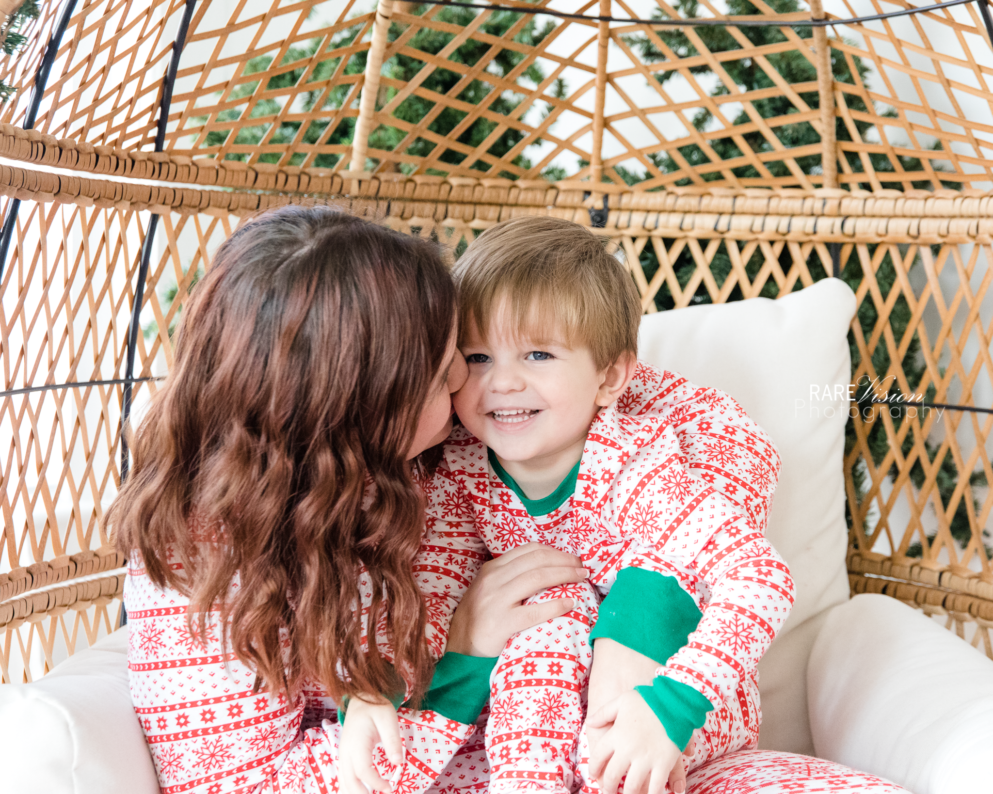 Image of mom and son in matching Christmas pjs