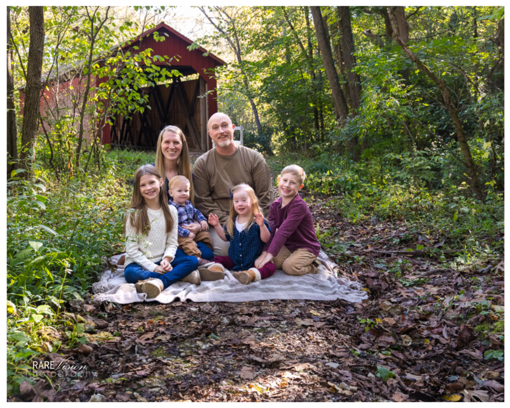 Image of family in front of Sandy Creek Covered Bridge in Hillsboro, Missouri
