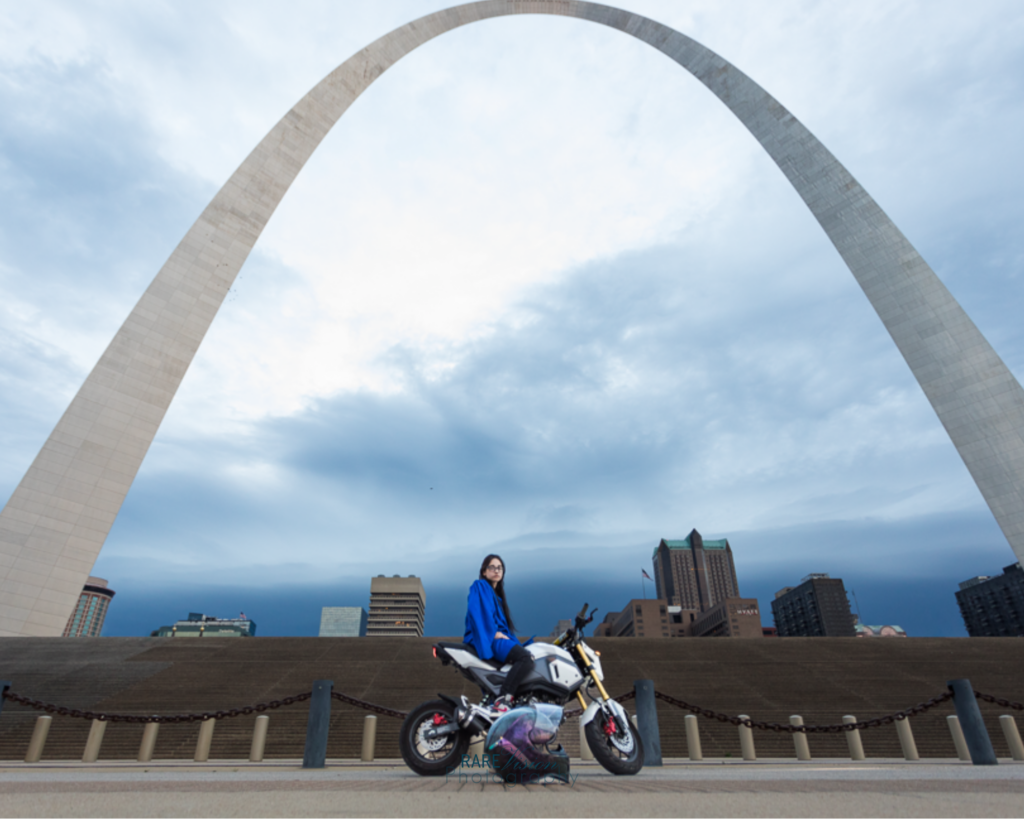 Image of senior on motorcycle under the Gateway Arch