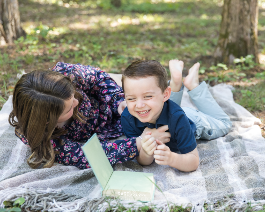 Image of tickle fight on blanket