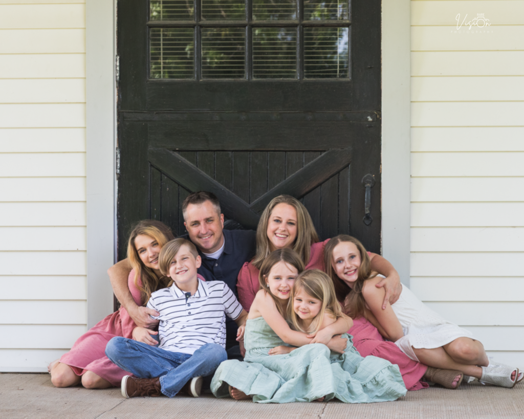 Image of the Browns in front of the barn at Queeny Park