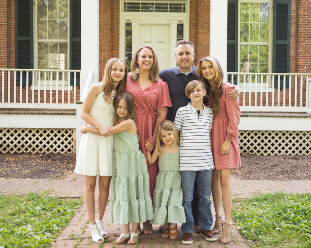 Image of family standing outside Jarville House
