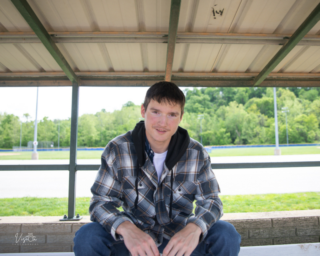 Image of senior in dugout
