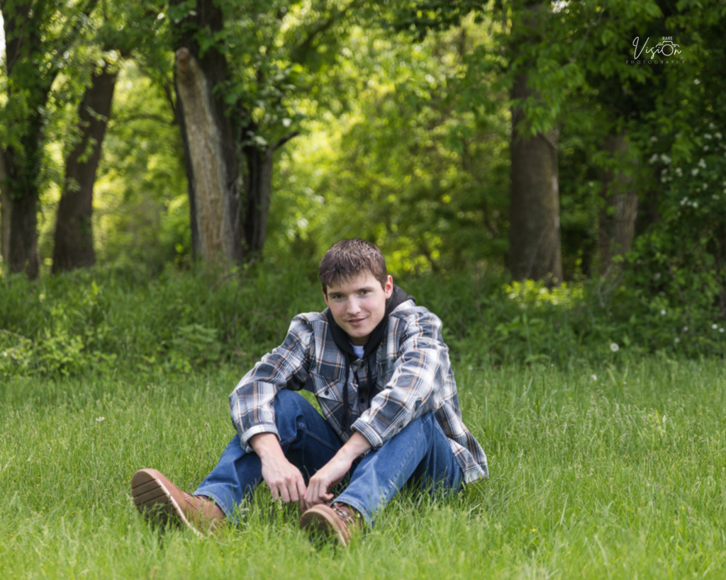 Image of senior sitting in field