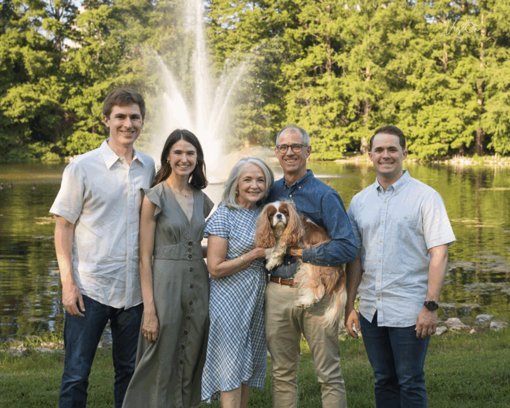 Image of family with grown children and dog