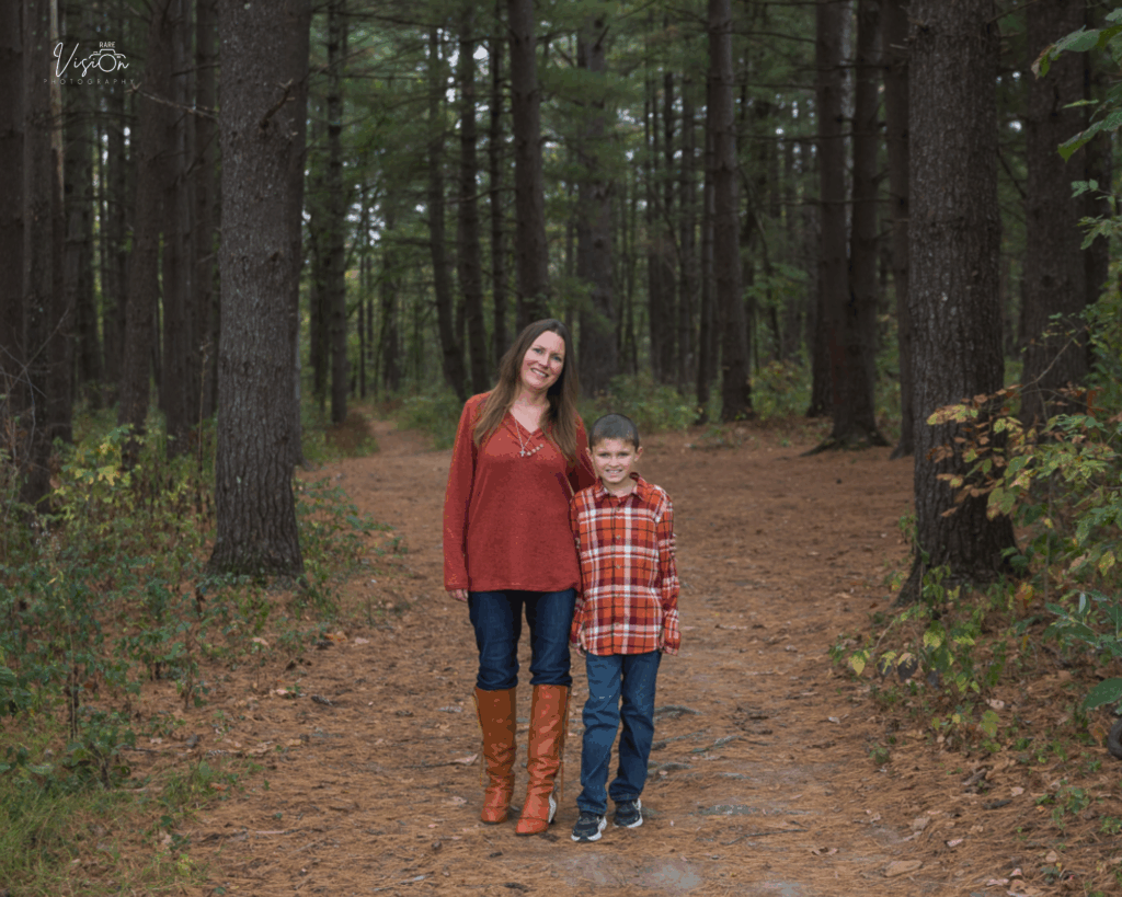 Image of mom and son in pine forest