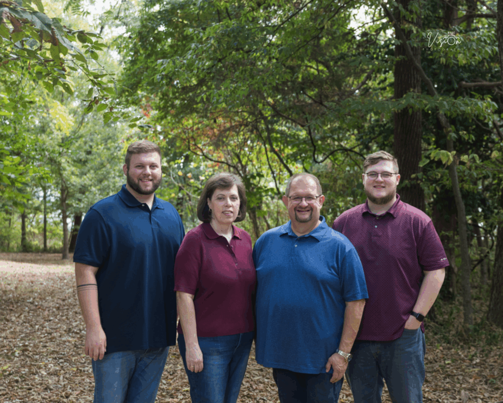 Image of family on tree lined path