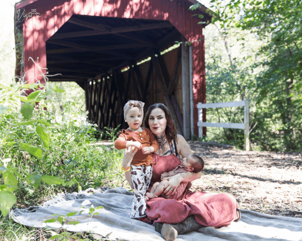 Image of mom on blanket with two daughters
