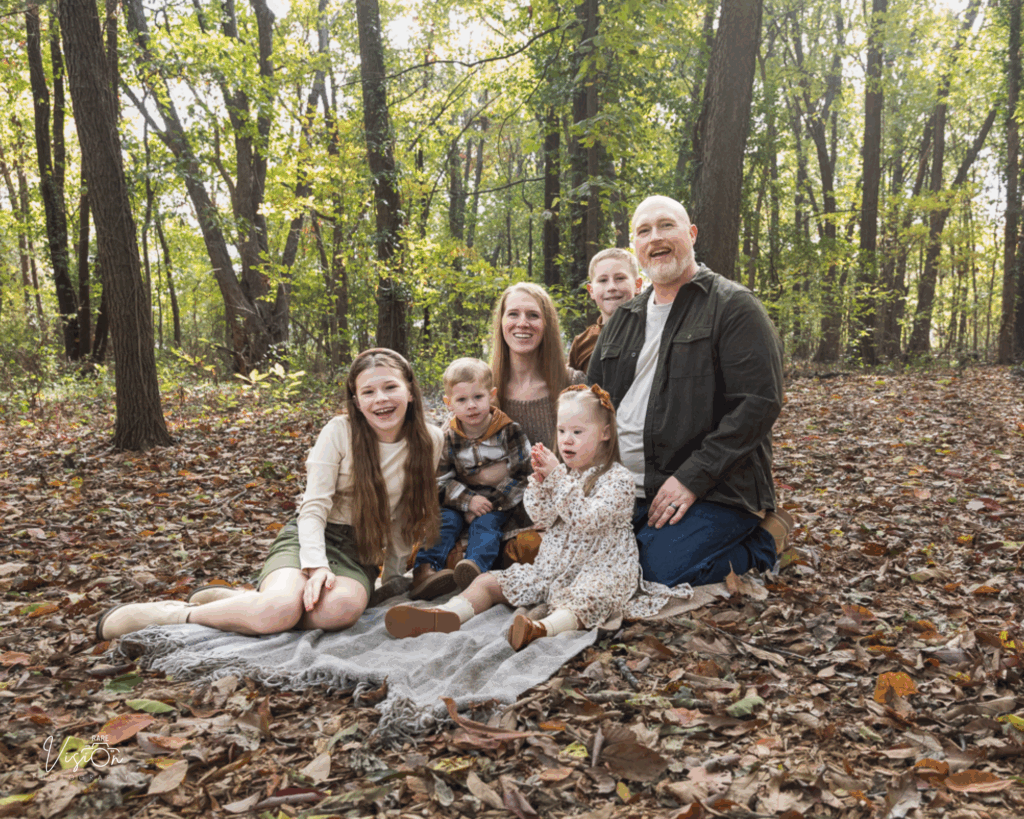 Image of family sitting in woods