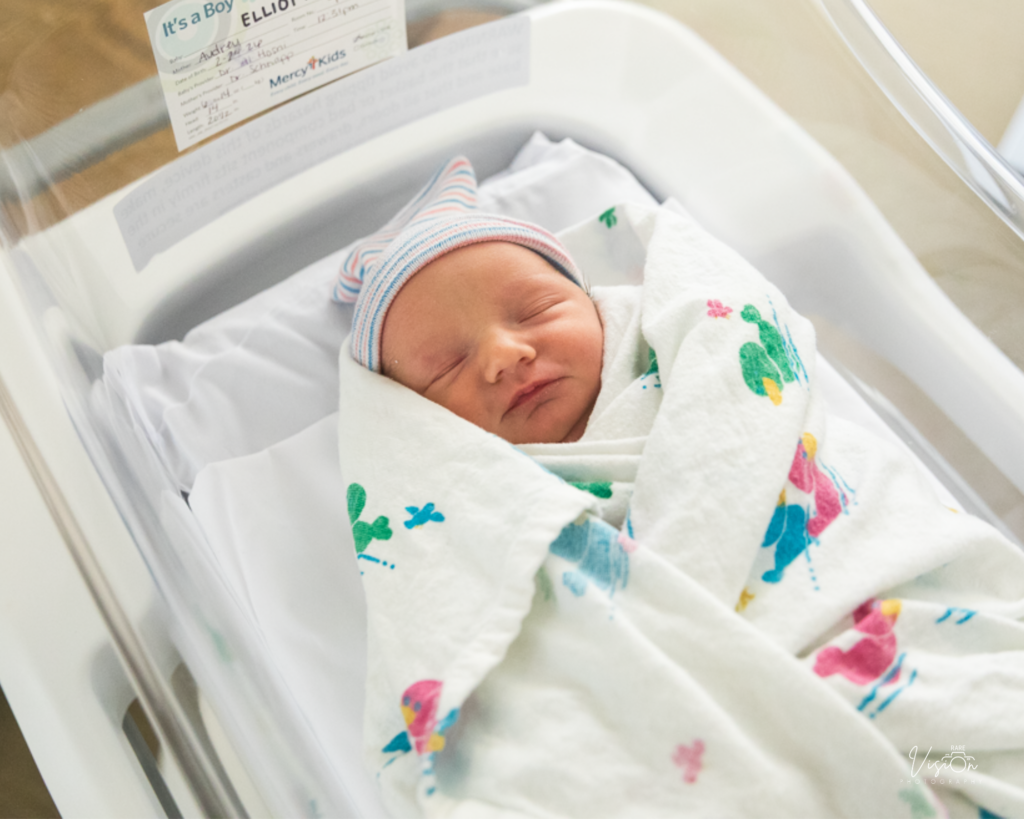 Image of baby in bed at hospital