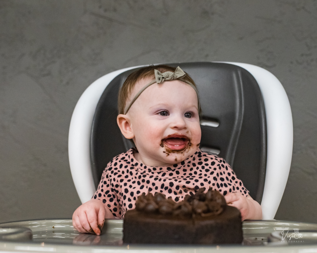 Cake smash moment at a birthday party.