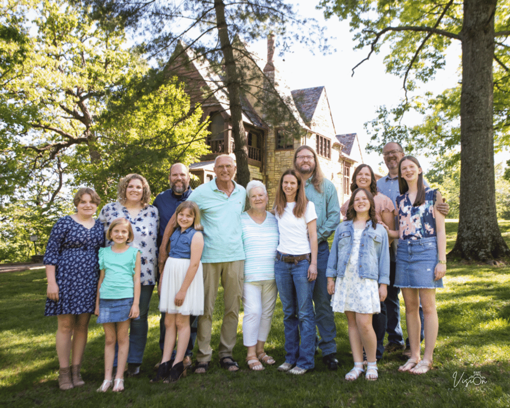 Image of entire family in front of Nims Mansion in Bee Tree Park