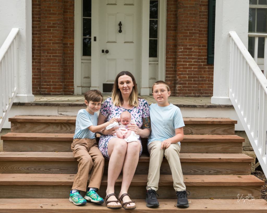 Image of mom with kids looking at camera