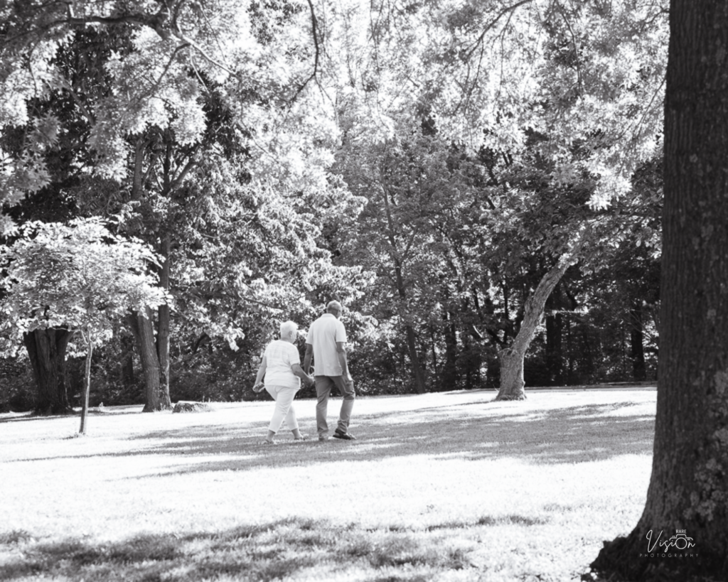 Older couple walking hand-in-hand