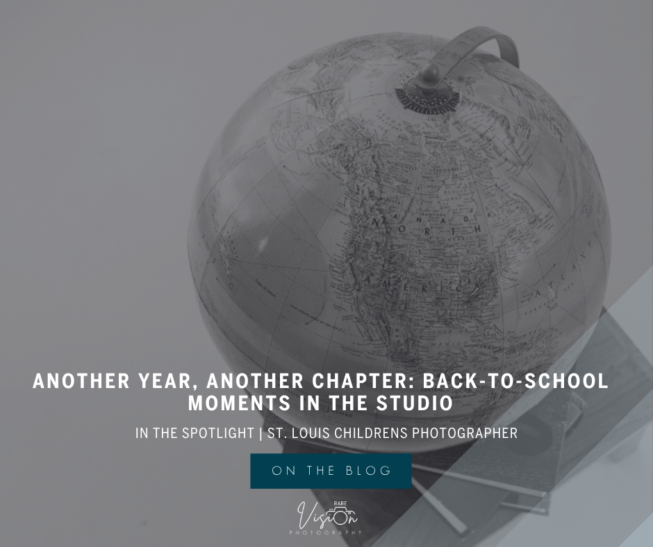 Black and white image of globe atop books