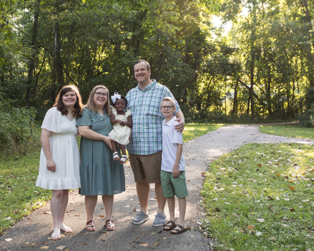 Image of family on trail looking at camera